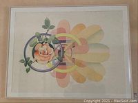 Full view of the framed Mary Holzwasser watercolor painting showing the rose and geometric design.