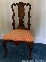 Front view of antique Dutch Queen Anne side chair with upholstered seat and carved wooden frame