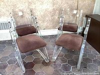 Four Lucite armchairs together, showing overall set condition.