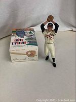 Warren Spahn figurine in Braves uniform holding glove overhead next to original box