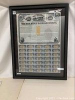 Full view of the framed Blue Ridge Railroad Company bank note and attached coupons, displayed upright against a wall.