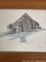 Close-up image of the barn artwork showing detailed pen and ink work and signature by Clark M. Goff.
