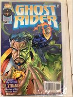 Close-up of the Ghost Rider comic book issue 77 with Dr. Strange on cover