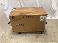 Front angle of sealed cardboard shipping box for GE Profile Advantium 120 microwave