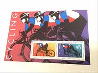 Close-up of cycling souvenir sheet with two 50-cent stamps in vibrant colors of orange, purple, and blue depicting cyclists.