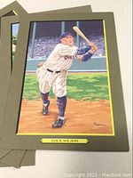Mounted baseball print depicting player Hack Wilson in white Giants uniform swinging bat on field.