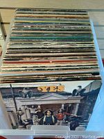 Top view of bin filled with assorted LPs, front showing Yes album
