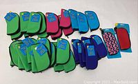 Photo showing multiple sunglasses cases in green, pink, blue, purple, and one patterned case, all new with tags.