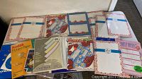 Full assortment of various papers including stationary, card stock, and photo paper