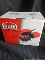 Box front displaying the Jobmate 1/4 sheet sander image and brand.