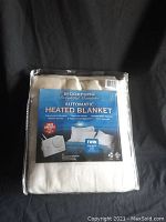 Front view of the new Biddeford Automatic Heated Blanket in original sealed packaging with blue product label.