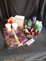 Full lot showing all beauty items including nail polishes, bath salts, silk scarf, waxing spatula, and spray bottles.