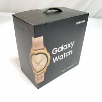 Photo of the Samsung Galaxy Watch retail box showing the front with an image of the gold-tone watch and branding.
