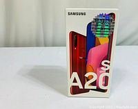 Front view of sealed retail box with Galaxy A20s image and branding