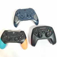 Three controllers grouped on a white background, showing Xbox, PowerA Fusion, and SteelSeries controllers