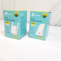 Photo of both boxed TP-Link Wi-Fi range extenders TL-WA855RE and TL-WA850RE, showing front and side packaging with branding, model numbers, and basic features.