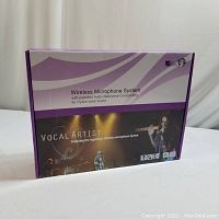 Vocal Artist branded wireless microphone system packaging box with purple and white design, indicating patented audio reference for crystal-clear sound.