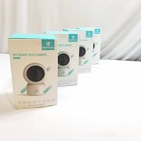 Four boxed Heimvision HM203 HD Smart WiFi cameras standing in a row showing front packaging.