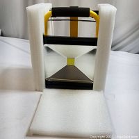 Full view of flood light secured with foam packaging