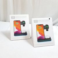 Two boxed 3-in-1 wireless chargers side-by-side, showing front of packaging with phone, watch, and earbuds charging illustration.