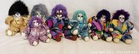 All seven Q-Tee clown dolls arranged side by side