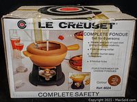 Box exterior showing Le Creuset branding, product image and features list