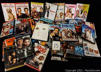 Photo showing a collection of 22 DVDs with titles focused on romantic comedies and some action films.