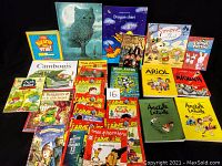 Full lot of children's French books including various series and titles shown flat against black background.