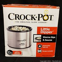Front of original product box showing Crock-Pot Little Dipper slow cooker, 16oz capacity and intended use for dips and sauces