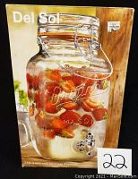 Photo of the original box showing a filled mason jar beverage dispenser with strawberries and ice inside, labeled with 'Del Sol' and embossed 'Original Mason'.