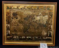 Front view of framed gold foil world map showing detailed continents and decorative borders