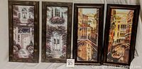 Four framed prints displayed side by side, showing architectural and canal scenes in vertical orientation