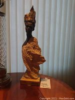 Front view of the full bust showing bronze head, textured clay torso and marble base with lot tag.