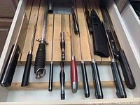 Drawer with eight long honing rods and sharpening steels