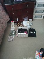 Overview of all items including flatware, napkin rings, coasters, pipe, and place card holders