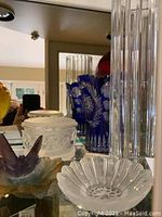 Overview of all five pieces displayed on shelf behind mirror