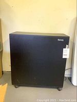 Full side view of the black rectangular Dynamic air cleaner with a white lot tag on the front.