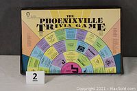 Top view of The Phoenixville Trivia Game board inside box showing circular trivia path and title.