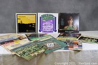 Photo showing 11 of the 20 vinyl LP albums, including Appalachian Dulcimer Music, Hootenanny for Orchestra, Barbra Streisand, and others spread out on table.