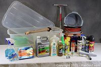 Photo of bins, buckets, cleaning sprays including Raid insect spray and other household items