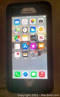 Front view of powered-on iPhone display showing app icons