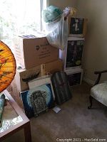 Stack of boxes and sample tombstones placed outside boxes