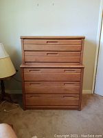 Front view of dresser showing two-piece chest-on-chest construction