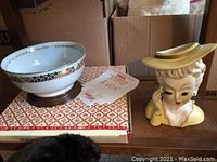 Photo showing the vintage head vase and Avon bowl with some packaging visible