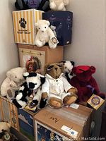 Full lot of collectible teddy bears stacked with original Vermont Teddy Bear boxes.