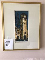 Full view of framed woodcut artwork by Gwyneth Travers under glass in gold frame