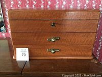 Closed wooden lockable silverware chest