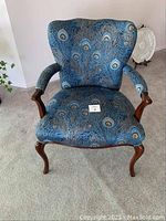 Front view of chair showing full profile and upholstery pattern