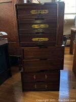 Three stacked wood drawer cabinets