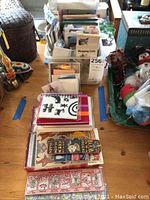 View of various stationery items organized in a plastic tub including cards and pads